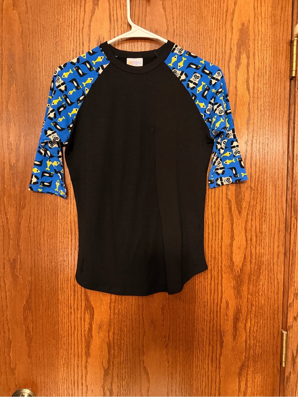 LuLaRoe Black Rashguard with Blue Patterned Sleeves